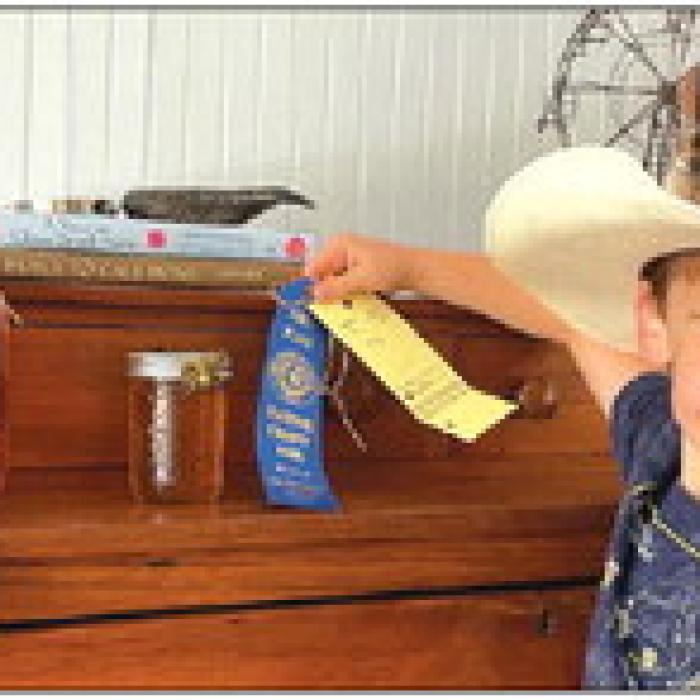 Emerson Parry with his 1st place winning honey.
