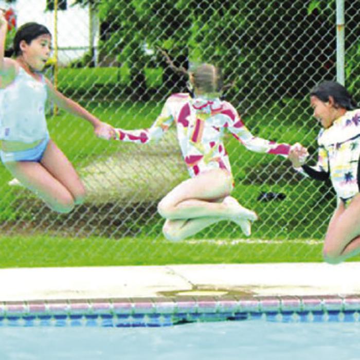 Kids jump into the La Grange city pool on Opening Day 2023, the last year the pool was open. Record file photo