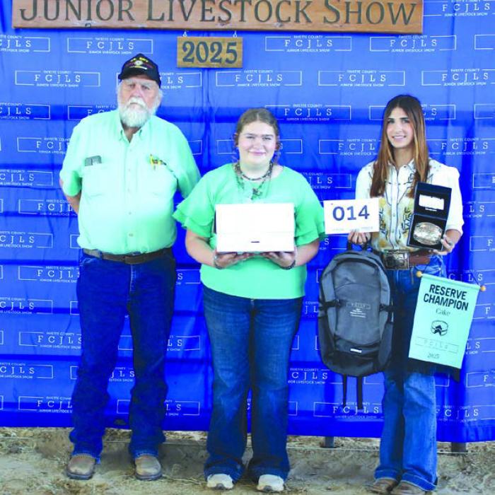 Reserve Champion Cake - Rheagan Karisch, Pure Country 4-H, $525; Buckle Sponsor - Brandon, Jennifer, and Carlie Jo Finke Buyer: Larry & Carolyn Bartosch; Picture: Larry Bartosch, Rheagan Karisch and Tegan Kallus - Holding Awards. 