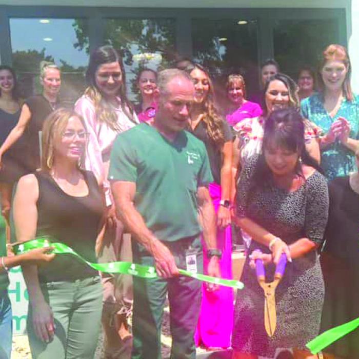Hello Beautiful Day Spa and Laser Center in La Grange held their ribbon cutting on Thursday, Aug. 24. April Marie Krhovjak, owner, cuts the ribbon at the opening of their new location at 520 W. Colorado St.