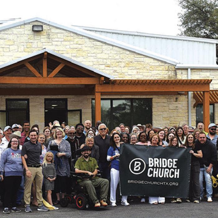 Group picture taken after the ribbon cutting at the church.