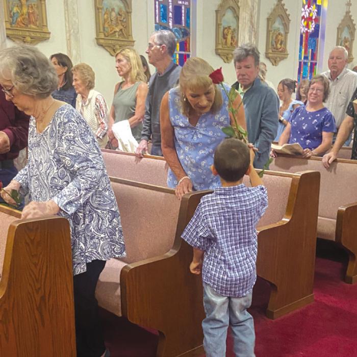 On Sunday, May 19, at Sts. Cyril &amp; Methodius Catholic Church in Cistern, all mothers were called up to the altar for a special blessing. KJZT St. Elizabeth Society No. 20 presented them with roses during the recessional hymn. Pictured is William Vinklarek with Laura Grudziecki. His mother, Tamara, and sister Lilly assisted.