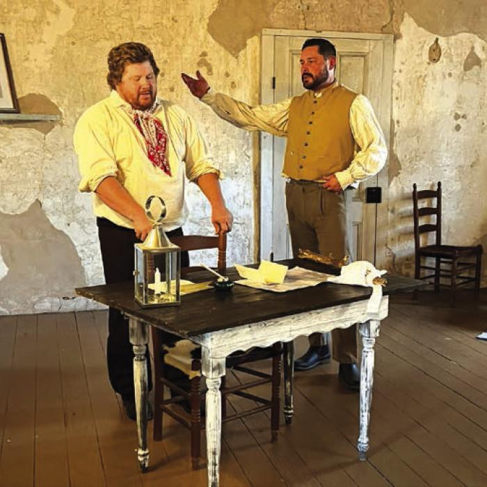 In Scene 3, Captain William Fisher (Brandon Theut) and his second- in-command, Thomas discuss their limited options during their besiegement at Battle of Mier, reimagined in the Kreische House.