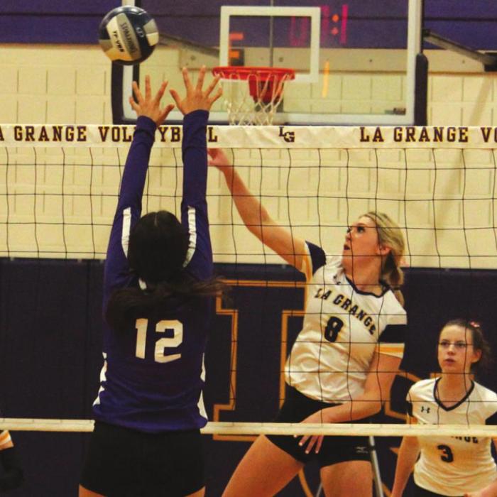 La Grange’s Layne Wied spikes a point for the Lady Leps in Friday’s win over Austin Achieve. Photos by Jeff Wick