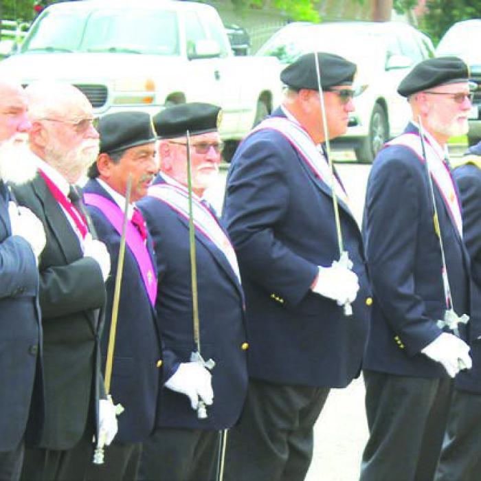 The members of the 4th Degree Knights of Columbus stood guard during the outside portion of Monday’s event.