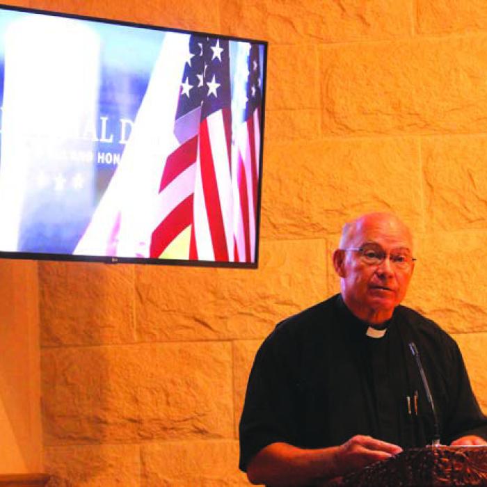 Father Steve Sauser, the priest at the Fayetteville and Ellinger Catholic churches, was the featured speaker at Monday’s ceremony, and talked about his service in the Marines in Japan prior to his becoming a priest.