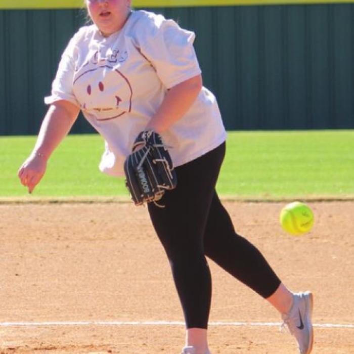 Top, left: Abbey Weyand pitching for the alumni team.