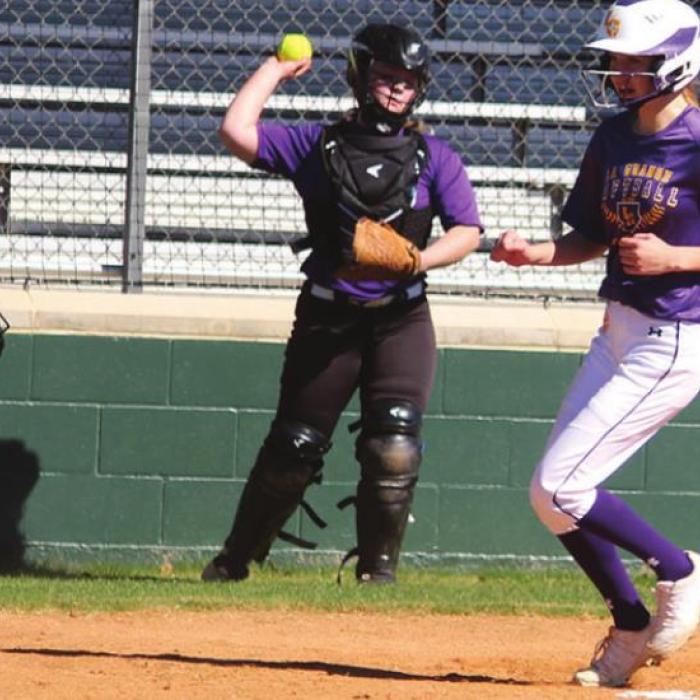 Bottom, right: Jenna Jobb scores what would be the winning run for the varsity. Photos by Jeff Wick