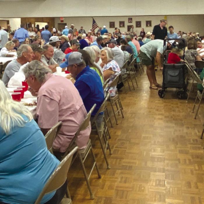 Visitors enjoying the BBQ meal at Fayetteville St. John Feast.