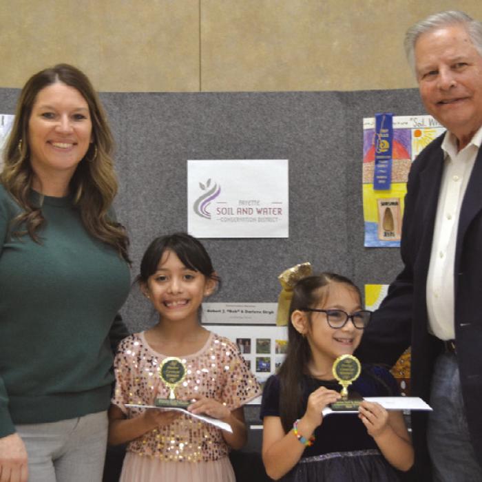 Poster Contest Winners (Division 1 - Grade K-2 presented by Megan Cooper-Cadence Bank and Gene Kruppa-Colorado Valley Communications: Reeanna Ramirez-Sacred Heart School and Daniela Albiter-Sacred Heart School.