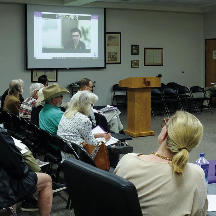Aaron Smith, Vice President of Development for Monarch Energy, appeared on screen via teleconference at the La Grange I.S.D. School Board meeting Monday night to answer questions about his company’s proposed hydrogen fuel generation plant. Monarch is seeking tax incentives from the school district. More than a dozen citizens spoke against the tax incentives at the meeting. Photo by Andy Behlen