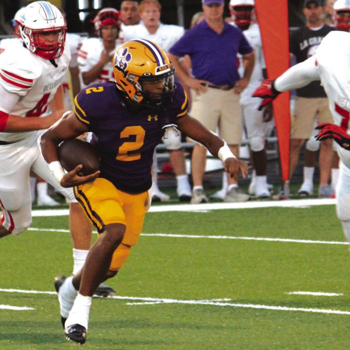 La Grange quarterback Jaden Williams looks for running room Friday. Photos by Jeff Wick