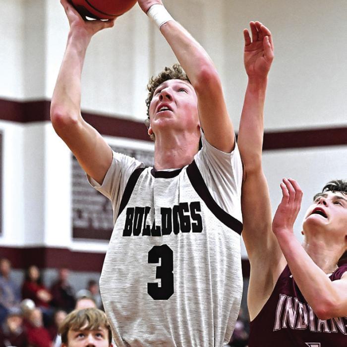 Camden Bosl goes up for two Tuesday night as district play wraps up and the Flatonia Bulldogs head to the playoffs.