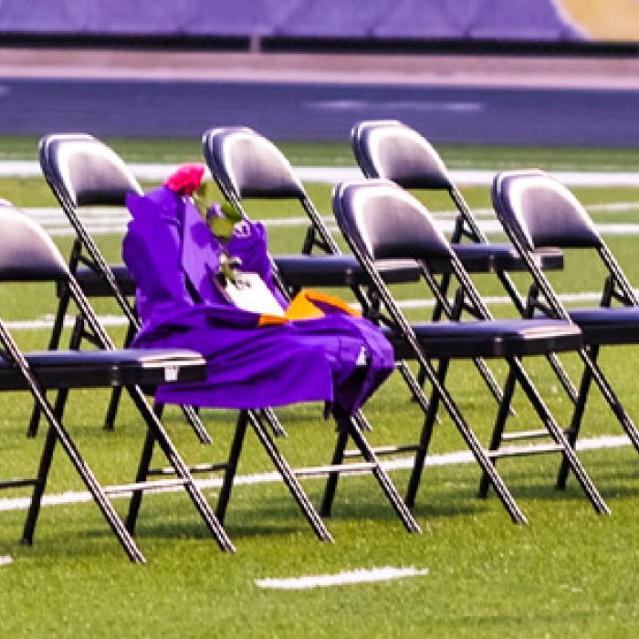The Class of 2025 lost one of their classmates last summer, Arie Stewart. An empty chair draped in a cap and gown was set up in her memory on the field during the ceremony.