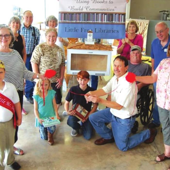 Fayetteville Chamber and Friends of the Library hosted a ribbon cutting ceremony to celebrate the installation of the first Little Free Library.