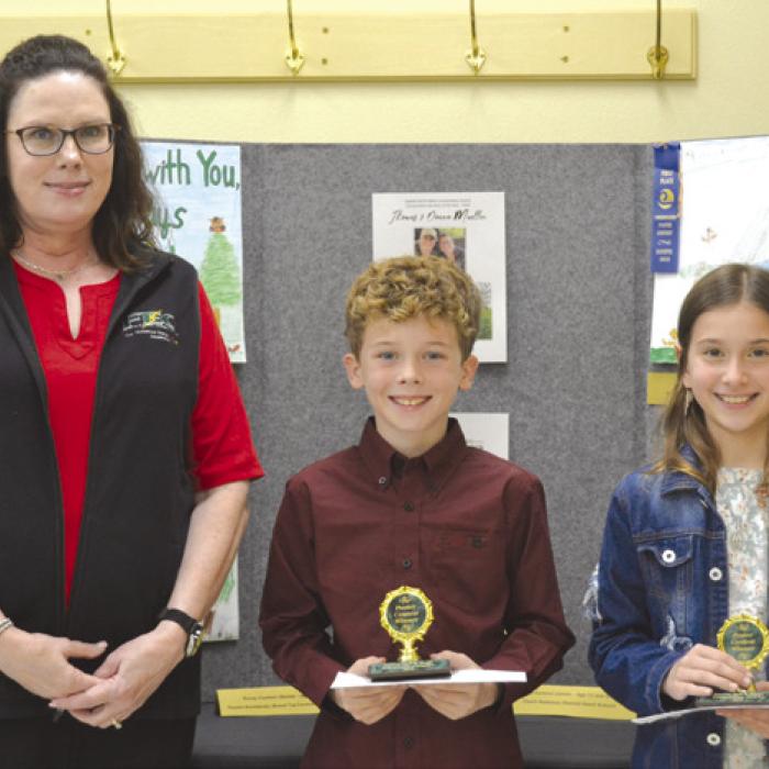 Poster Contest (Division 2; Grades 3-6): Carter Weyand (Round Top-Carmine Elementary) and Brielle Goedrich (St. Rose of Lima); presenter: Tracy Denton of Fayette Electric Cooperative.