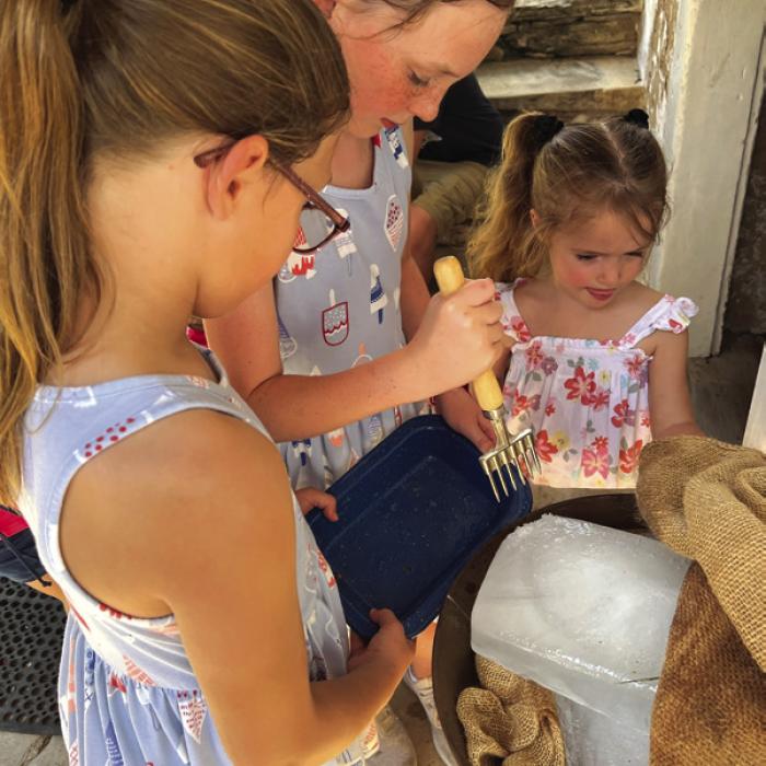 Ice blocks must be broken into smaller chips to fit inside the ice cream churner. Families can race to see who can chip the most ice off the block.