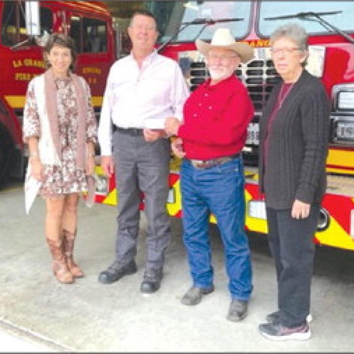 Hostyn KJT Society No. 3 presented a Christmas donation to the La Grange Volunteer Fire Department. Present for the picture are from left: KJT Treasurer Brenda Fietsam, La Grange Fire Chief Frank Menefee, KJT Vice President Benedict Kallus, and KJT Secretary Joyce Muras.