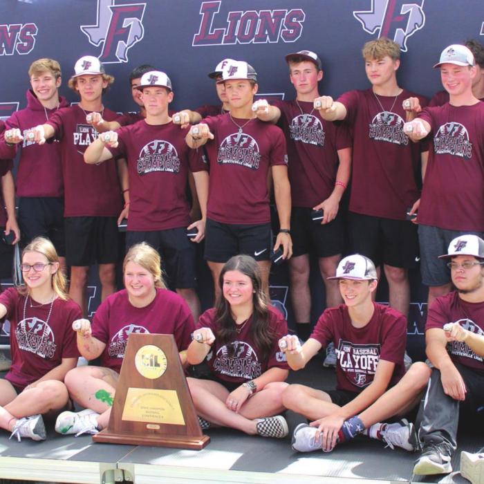 The team poses for a group shot with their new rings. Photos by Jeff Wick