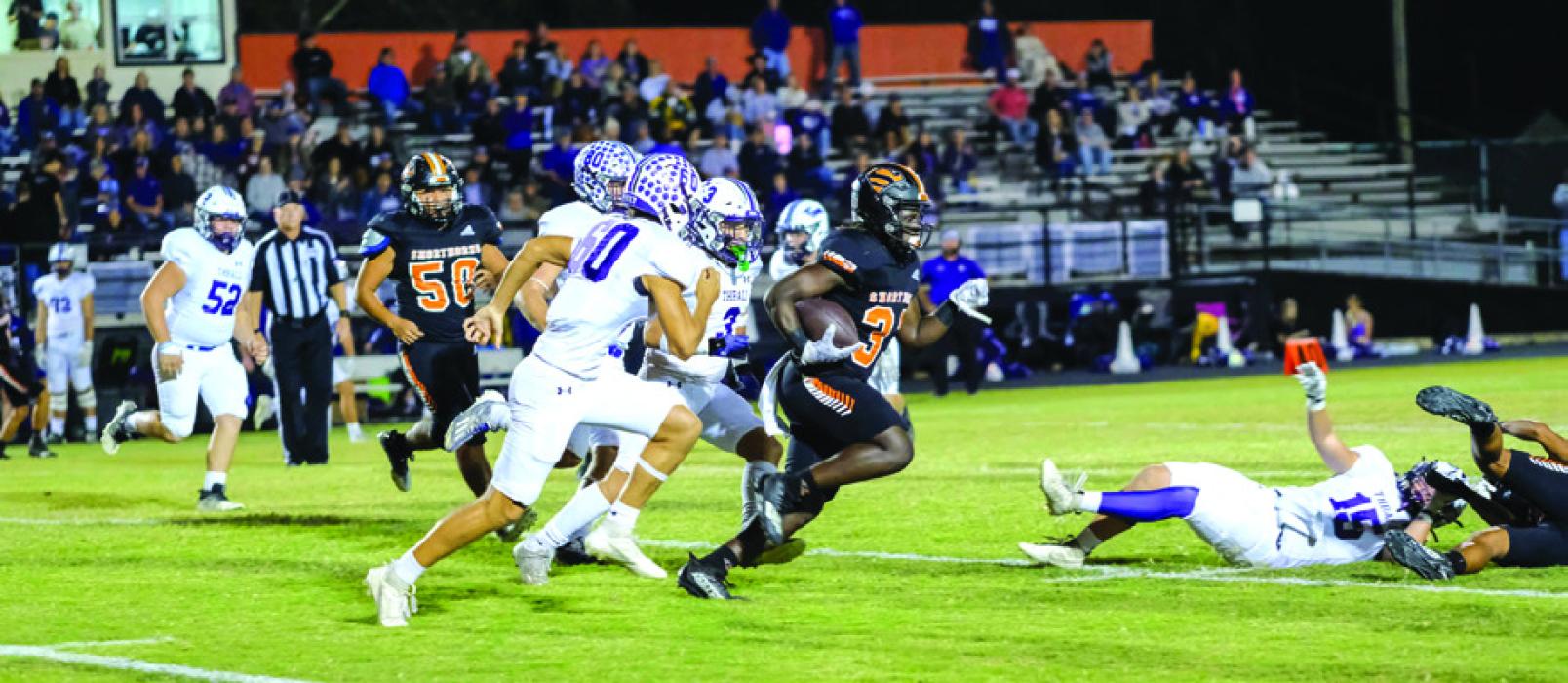 A host of Schulenburg defensive players converge to make this tackle Friday against Thrall. Photo by Audrey Kristynik A pack of Thrall Tigers chases Shorthorn senior running back Rodney Walton. Photo by Andy Behlen