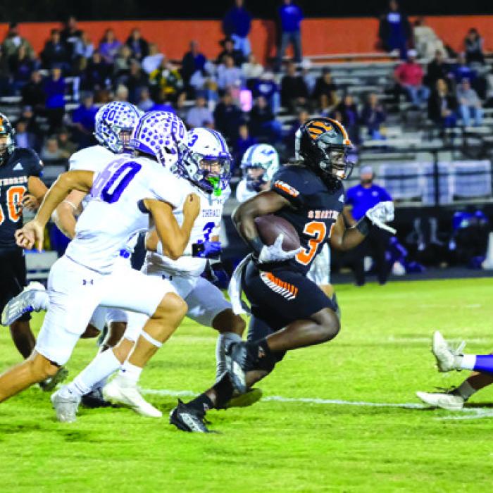 A host of Schulenburg defensive players converge to make this tackle Friday against Thrall. Photo by Audrey Kristynik A pack of Thrall Tigers chases Shorthorn senior running back Rodney Walton. Photo by Andy Behlen