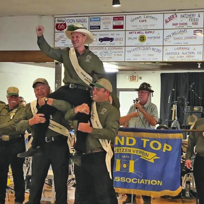 Kyle Fricke is hoisted on the shoulders of fellow Round Top Rifle Hall members as he was crowned 2026 Schützenkönig in Round Top Sunday. Round Top Rifle Hall photo
