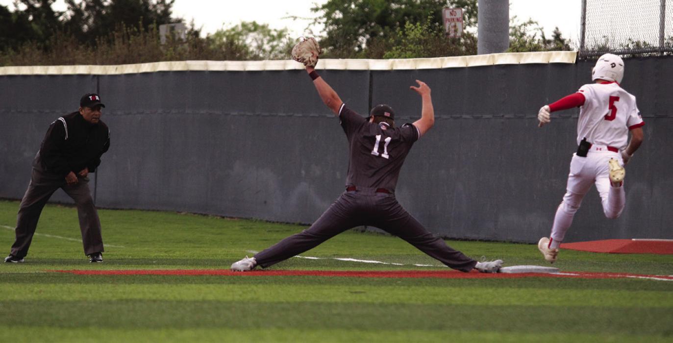 Fayetteville’s Parker Vitek makes a big stretch at first to get an out in Tuesday’s game.