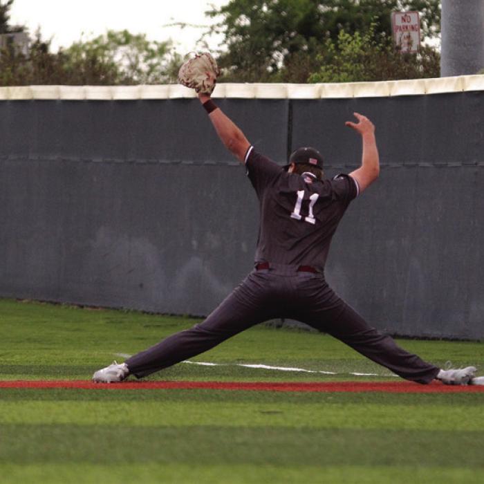 Fayetteville’s Parker Vitek makes a big stretch at first to get an out in Tuesday’s game.