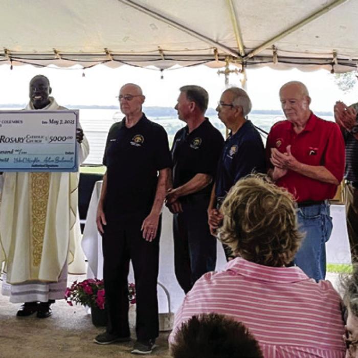 Knights of Columbus Council No. 10333 from Austin presented a $5,000 donation to Queen of the Holy Rosary Catholic Parish in Hostyn to assist with the church’s rebuilding efforts. The Austin KC members presented the donation during the Hosty May Fest picnic on May 7.