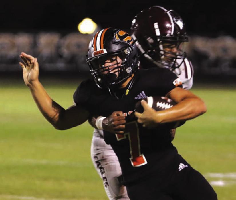 Schulenburg’s Bryce Stoever battles for yardage as a Hearne player tries to bring him down Friday. Photo by Audrey Kristynik