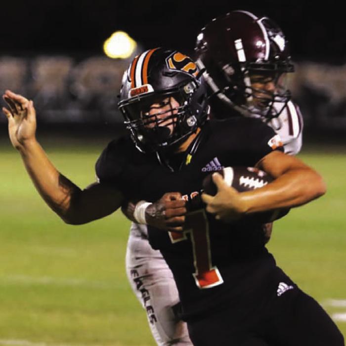 Schulenburg’s Bryce Stoever battles for yardage as a Hearne player tries to bring him down Friday. Photo by Audrey Kristynik
