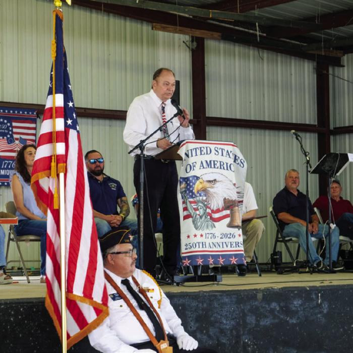 County Judge Dan Mueller delivers a speech at the Flag Day celebration on Sunday.