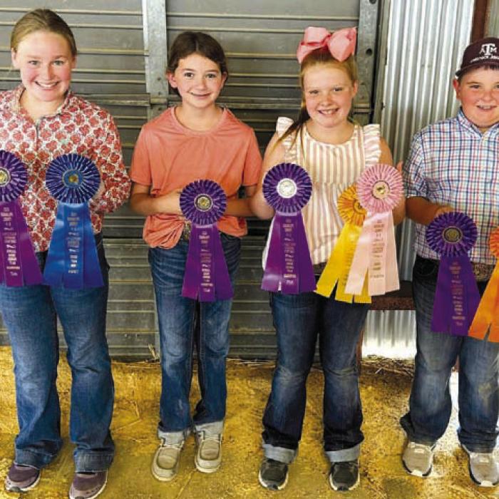 Champion Junior Team: Julia Melton, Laramie Laake, Kaisley Janecka, and Abraham McBride.