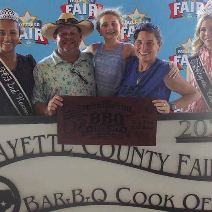 The team of Just Twisted won first place in beans at Saturday’s Fayette County Fair Bar-B-Q Cook Off. Left to right, 2025 Queen second runner-up Keanna Henderson, Shawn, Shelby and Sequoya Janacek, and 2025 Fair Queen Hailey Janish.