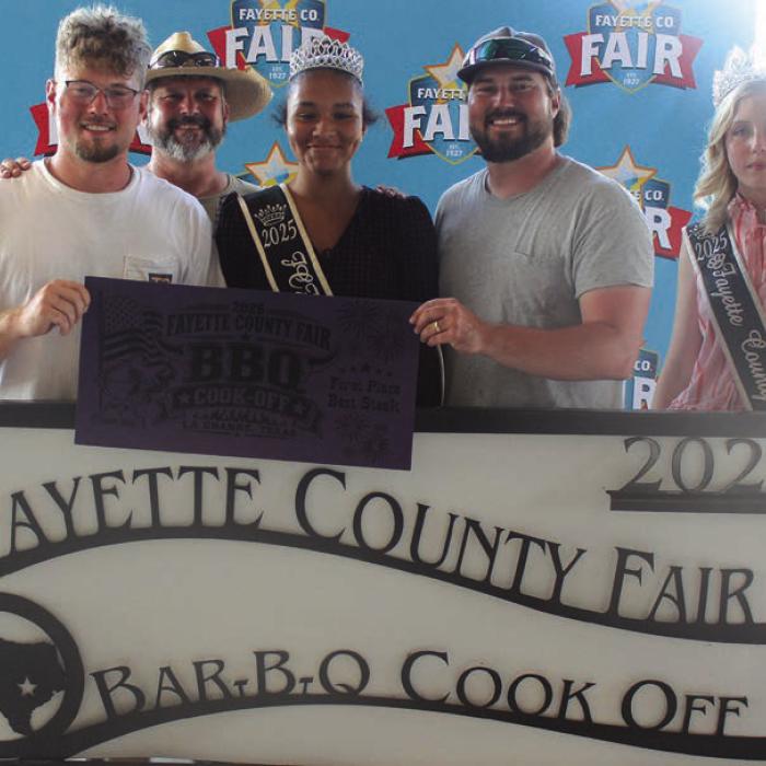 The team of Q’d Up Cookers won first place in steak at Saturday’s Fayette County Fair Bar-B-Q Cook Off. Left to right, Dalton Caughman, head cook Shawn Caughman, 2025 Queen second runner-up Keanna Henderson, Tyler Caughman and 2025 Fair Queen Hailey Janish. Not pictured J.P. Ingram.