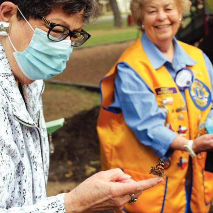 La Grange mayor Janet Moerbe waits for her butterfly to take flight during Saturday’s ceremony. Photos by Jeff Wick