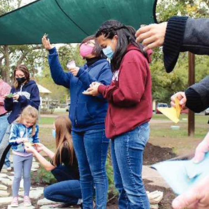 Left: More images from Saturday’s event, including, the painting of the rainwater cistern that will water the garden.