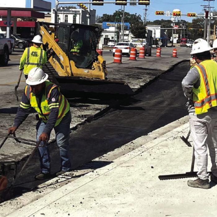 Contractors for the Texas Department of Transportation laid down some pavement Friday for the intersection widening project at Travis St. and Jefferson St. in La Grange. Photo by Andy Behlen