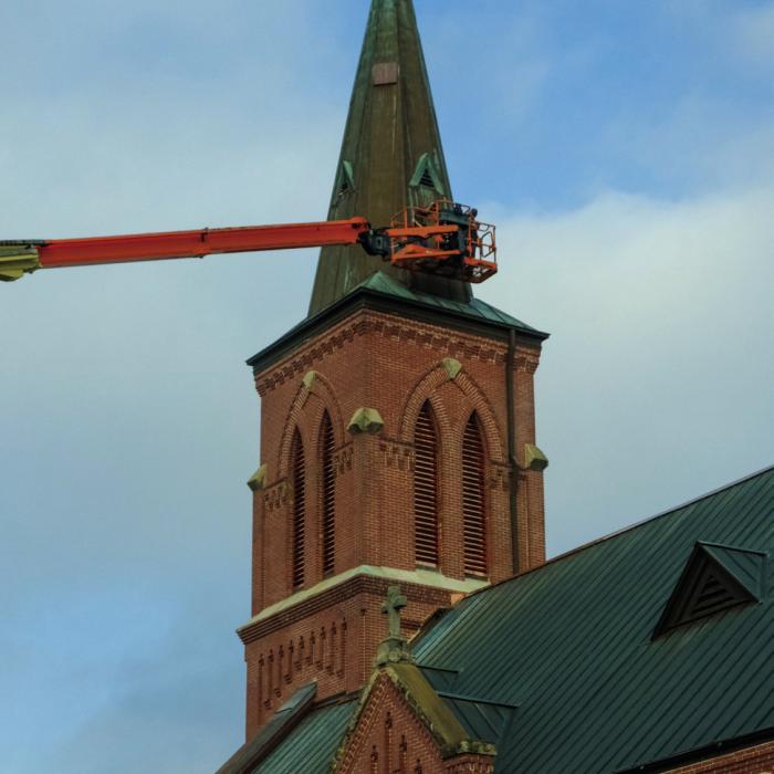 Workers with Texas Built Roofing of Waco performed repairs on the roof of St. Mary’s Catholic Church in High Hill. Notice the new copper louvers that have been installed in the bell tower. Workers also replaced the church’s ridge cap and several gutters. Photo by Andy Behlen