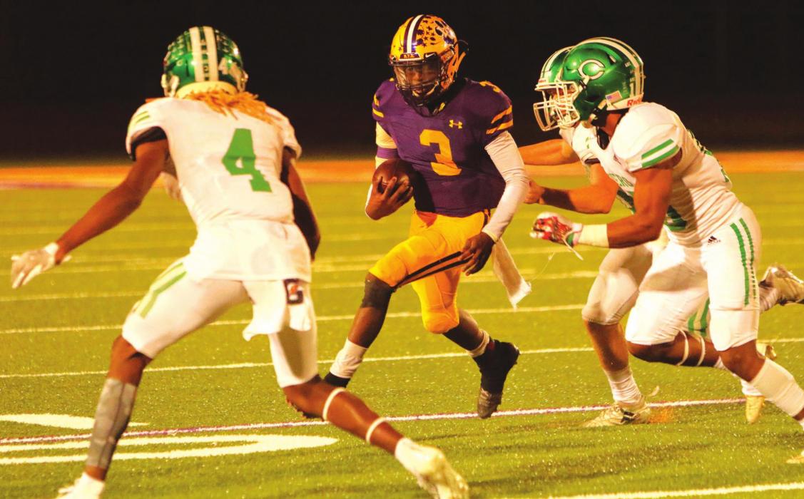 La Grange’s C.J. Davis is surrounded by Cuero tacklers in Friday’s game. Photo by Darrell D. Gest