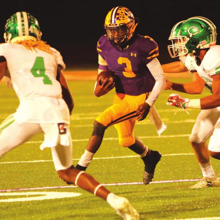 La Grange’s C.J. Davis is surrounded by Cuero tacklers in Friday’s game. Photo by Darrell D. Gest