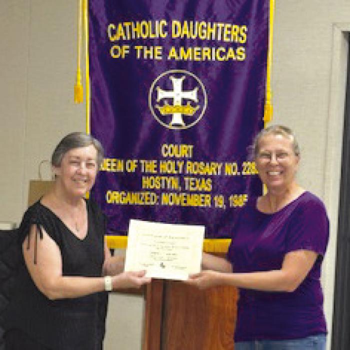 CDA Court Queen of the Holy Rosary received two awards at the State Level at the Convention held in Dallas April 23-27. The Court won a first place award in the State Circle of Love Contest in Category IV Education. Accepting the award is Shirley Macik, Local Education Chair, and Sarah Koehl (Regent).