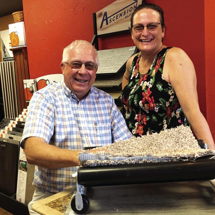 Gary and Gale Lincke, who own and operate Lincke Floors Inc. in La Grange, are shown here celebrating the family-owned business’s 70th anniversary in June 2021. This Tuesday the Linckes will celebrate the 75th anniversary of the business. The next day they are closing for good. Record file photo by Elaine Thomas