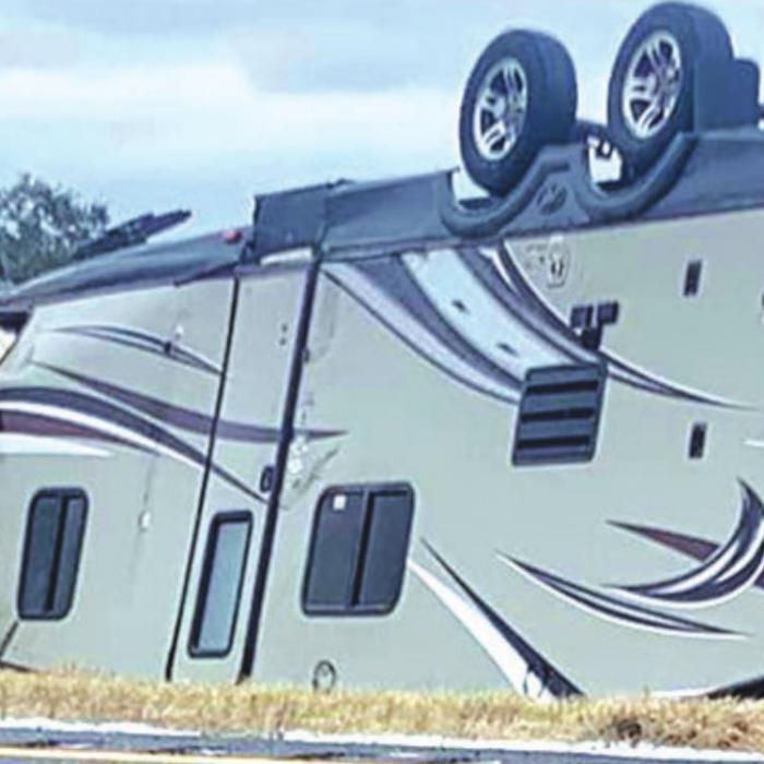 Icy conditions on Thursday, Feb. 3, contributed to a rollover accident on Interstate 10 in Schulenburg. An SUV pulling a camper trailer west on I-10 rolled over just west of the US 77 overpass around 4 p.m. last Thursday. Officials reported ice on the bridge at the time. No one was injured, but the accident blocked traffic in the westbound lane for about an hour while emergency workers cleared the wreckage. Photo courtesy of the Fayette County Sheriff’s Department