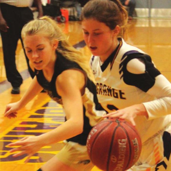 La Grange’s Katelynn Allen, shown above against the defense of Giddings’ Sadie Claxton, made a game-tying jumper with 20 seconds left in Tuesday’s game but Giddings rallied for a 45-43 win. Photo by Jeff Wick