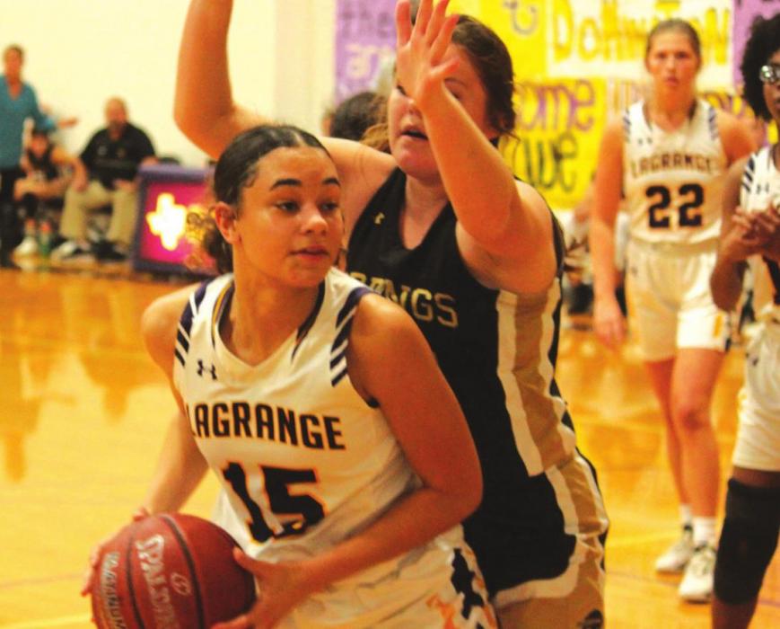 La Grange’s Camille Gonzalez looks to make a move to the basket against the defense of Giddings’ Kaylon Metcalf.