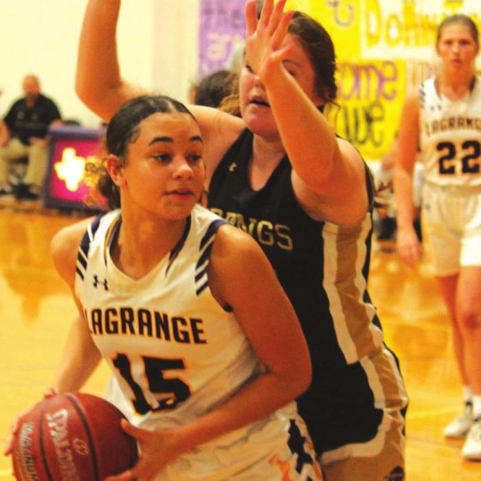 La Grange’s Camille Gonzalez looks to make a move to the basket against the defense of Giddings’ Kaylon Metcalf.