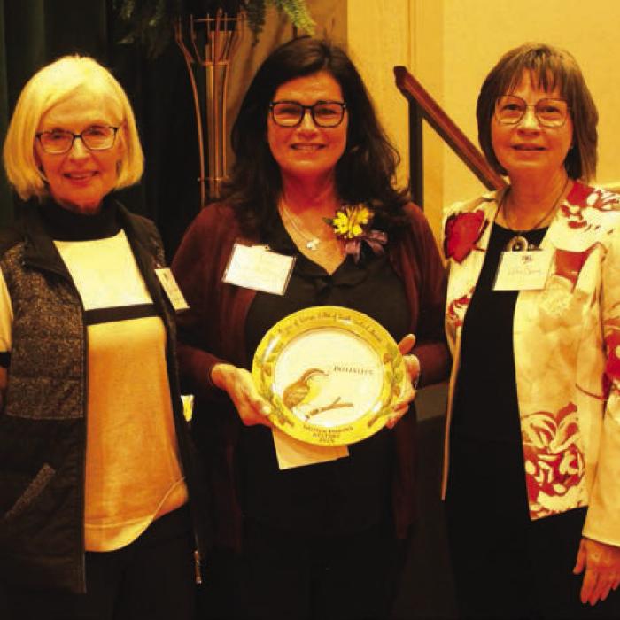 Teresa Stanley Brown, center, Director of the Gardenia E Janssen Animal Shelter was honored Sunday in the area of “Initiative.” Introducing her was Dr. Karen Bookout, left. Right is LWV program coordinator Helen Niesner.