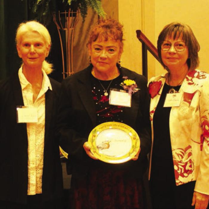 Maria Vega, center, was honored Sunday in the area of “Courage.” Introducing her was Connie Shortes, left. Right is LWV program coordinator Helen Niesner.