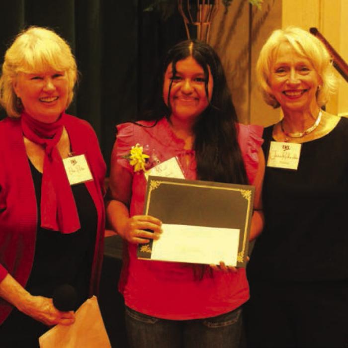 Mariel Arredondo, center, of Yoakum, was one of the Student Writing Showcase winners for her essay on Jovita Idar. Left is program MC Elota Patton. Right is Janis Richardson President, League of Women Voters of South Central Texas.